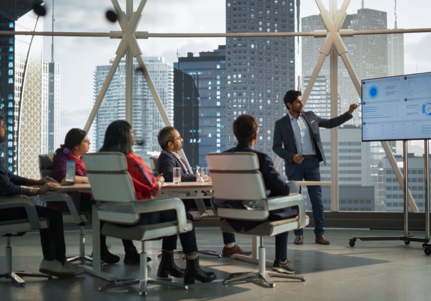 Business meeting with presentation in modern office.